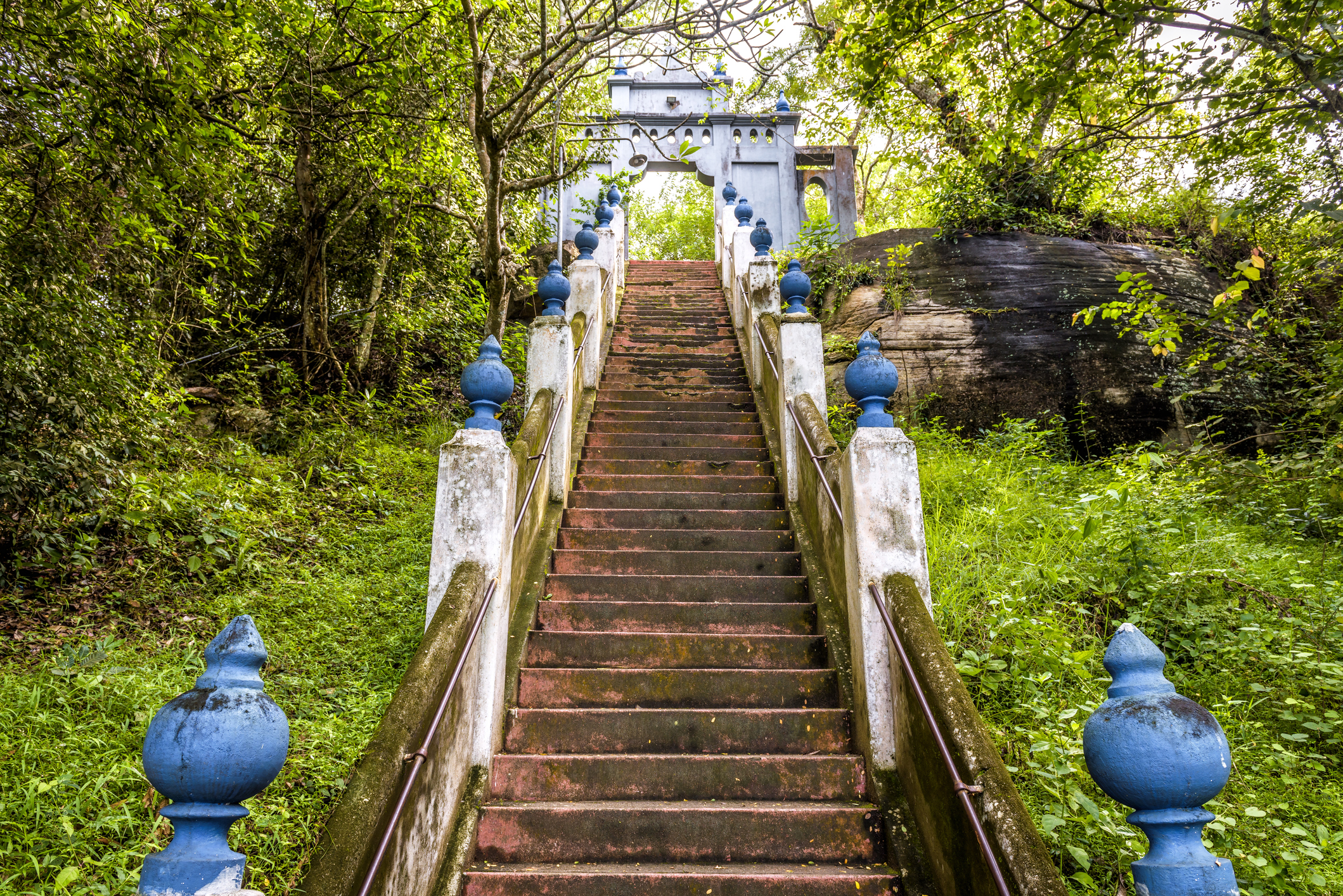 Stairs in ancient Buddhist rock temple in Mulkirigala, Sri Lanka