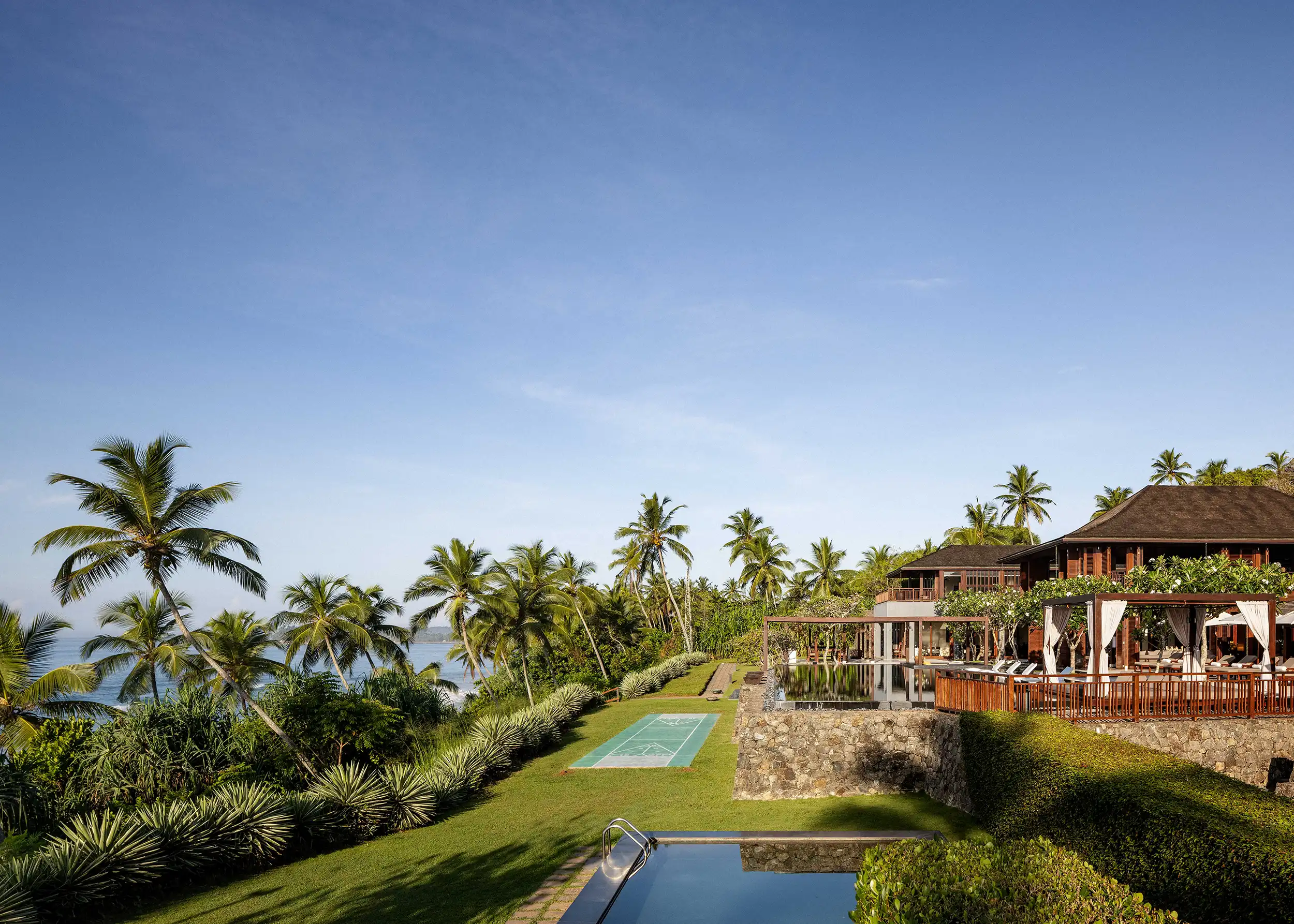 ÀNI Sri Lanka luxury private resort overlooking the Indian Ocean, surrounded by lush tropical landscapes